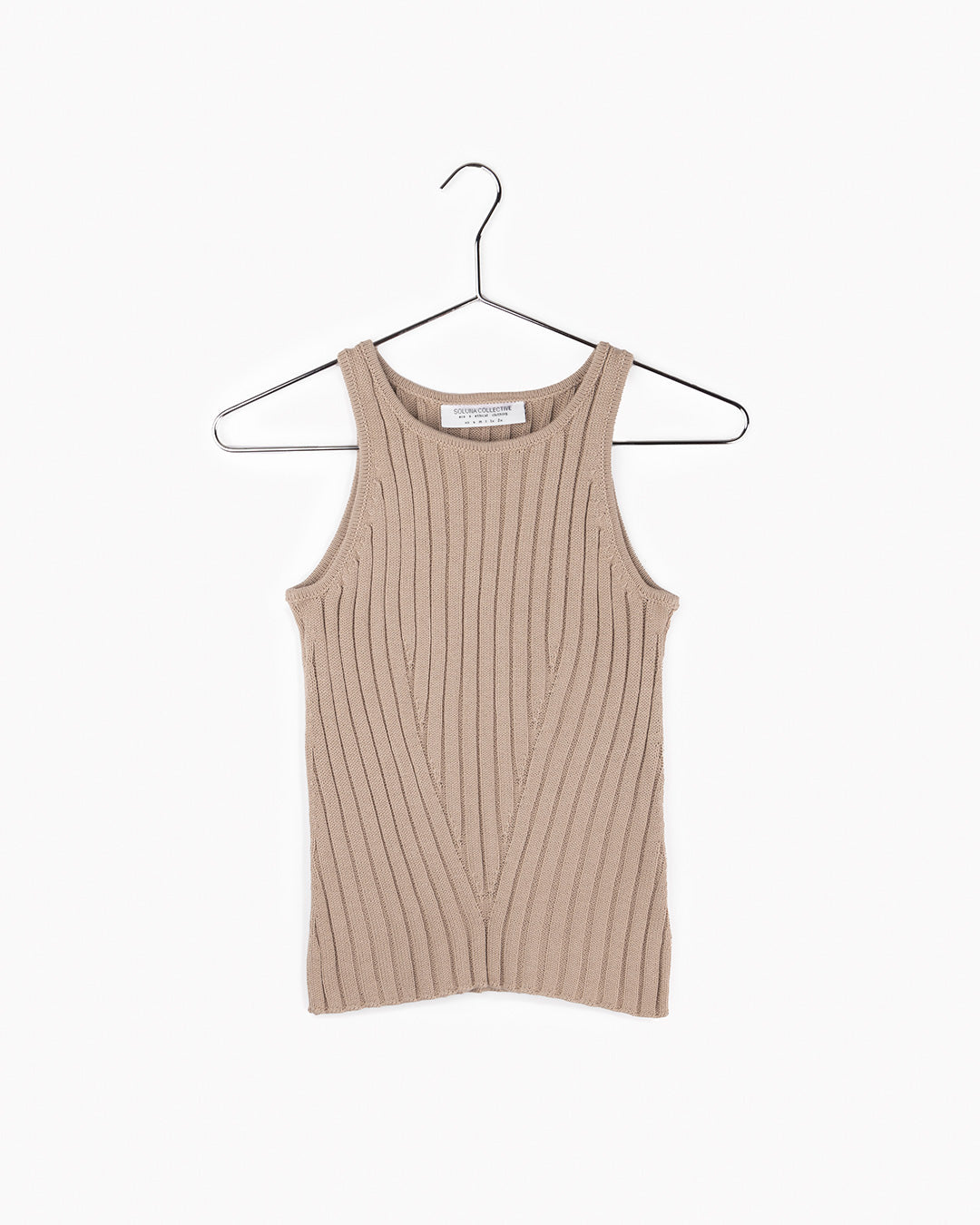 This photo shows a flat lay of the sand knit tank showing the ribbed pattern.
